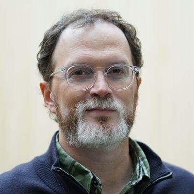 Man with beard and glasses.