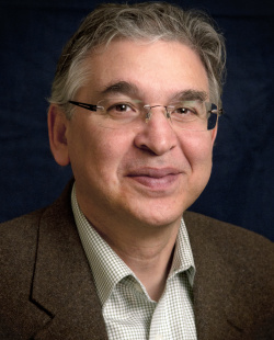 Man wearing glasses and brown sport coat.